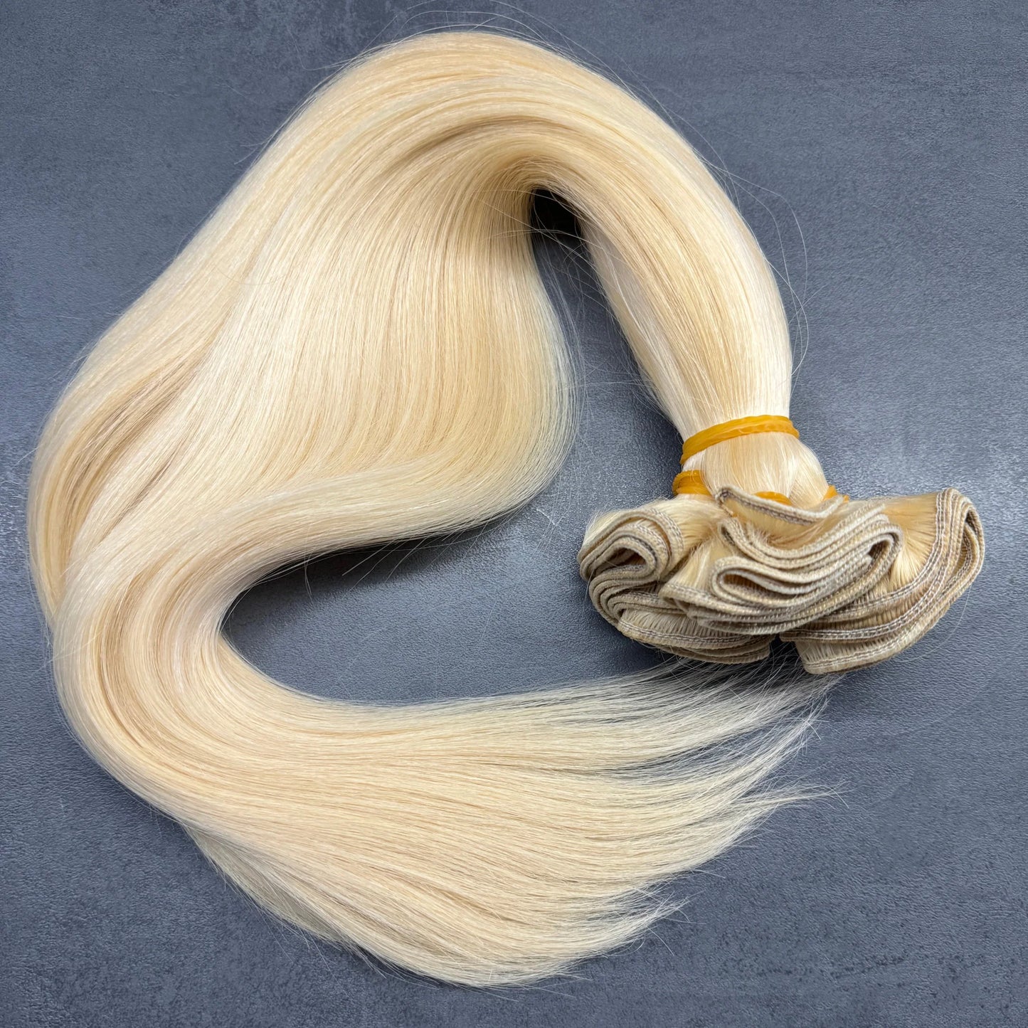 Gépi tresszelt (9.0-10.0) kazahsztáni vékonyszálú szőke póthaj